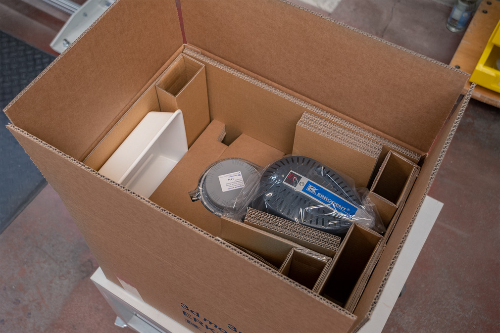 After inspection, the dental thermoforming devices are packaged so they can be safely transported.